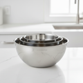 3-piece stainless steel mixing bowl set nesting on white kitchen counter